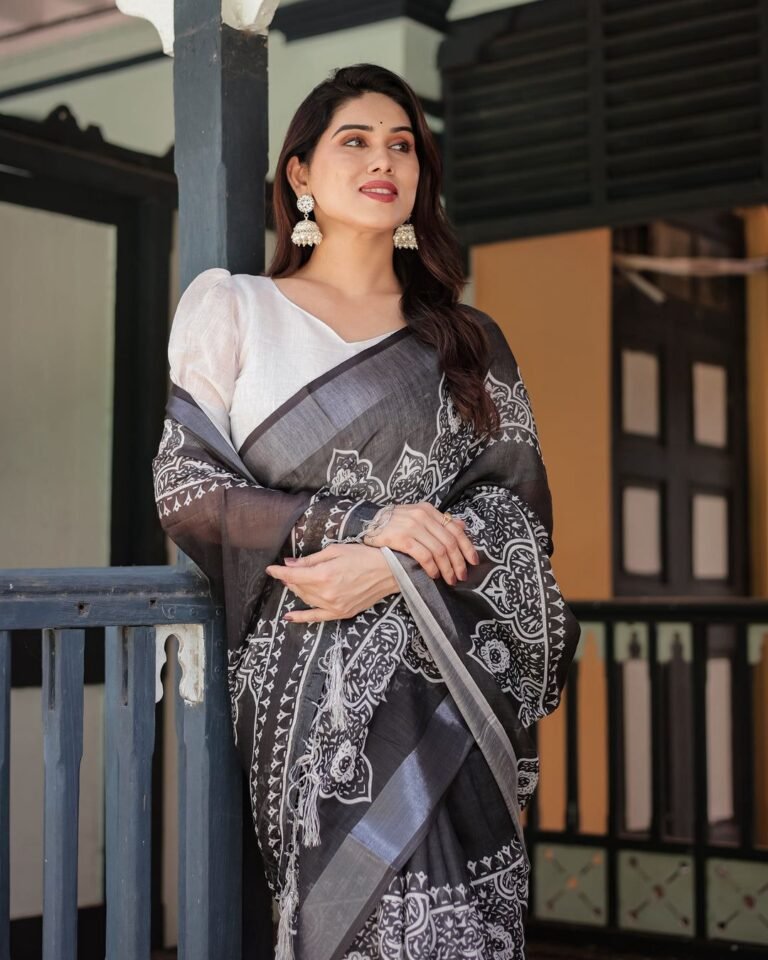 Black linen cotton saree draped with silver weaving patta pallu