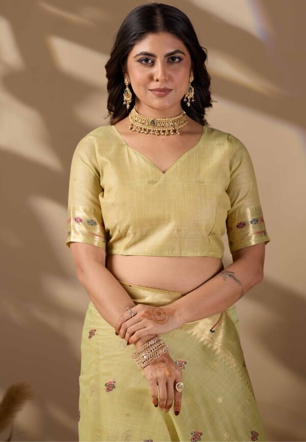 Pista green Paithani cotton saree drape and zari border detail