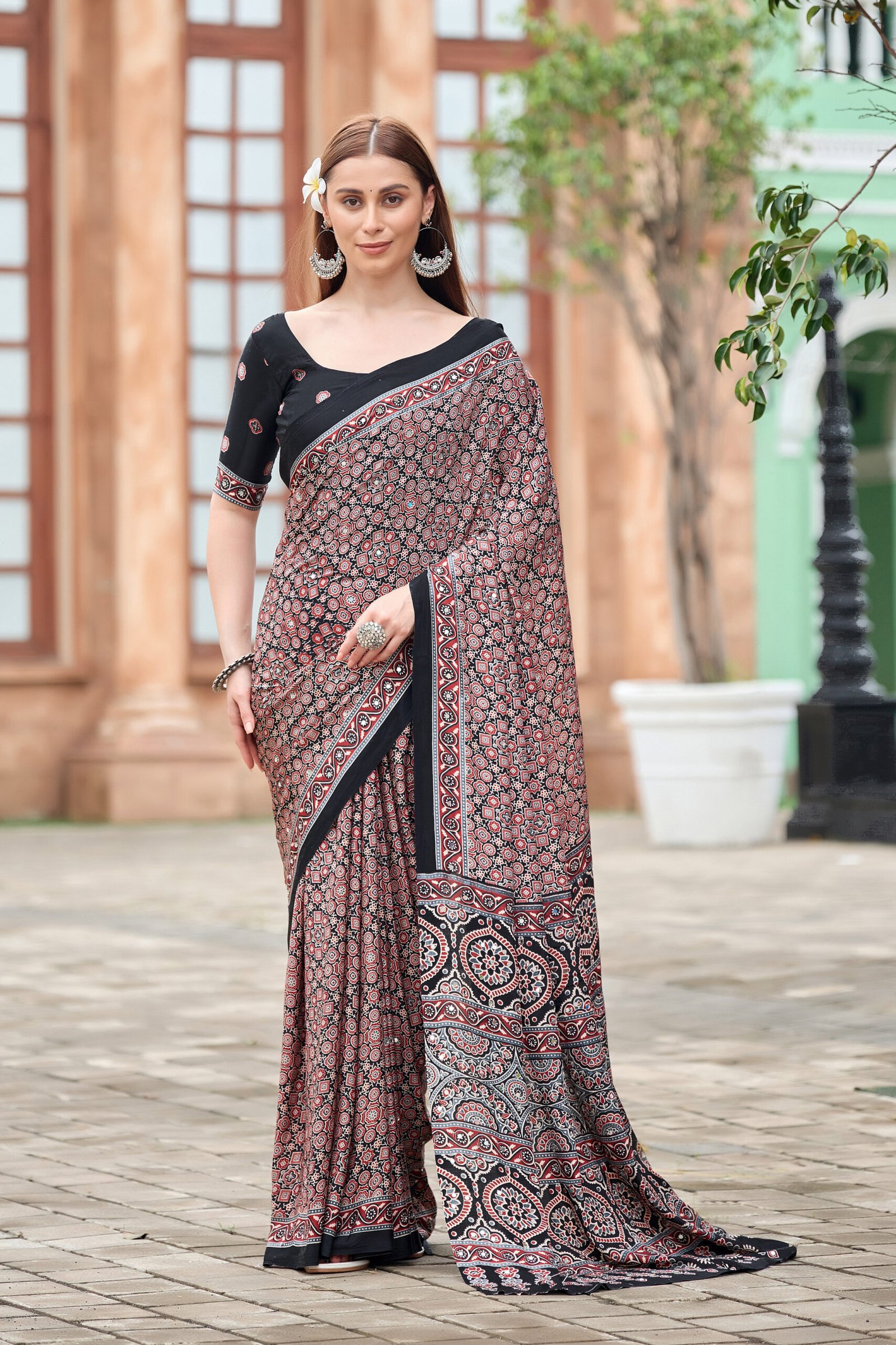Rose ajrakh print crepe saree with black border and designer pallu